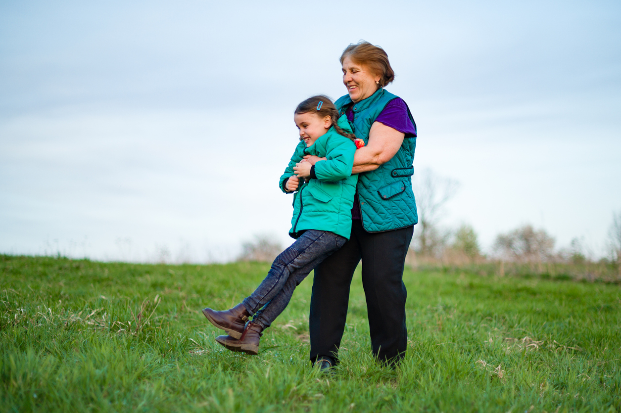 A heartwarming scene of an elderly woman playfully